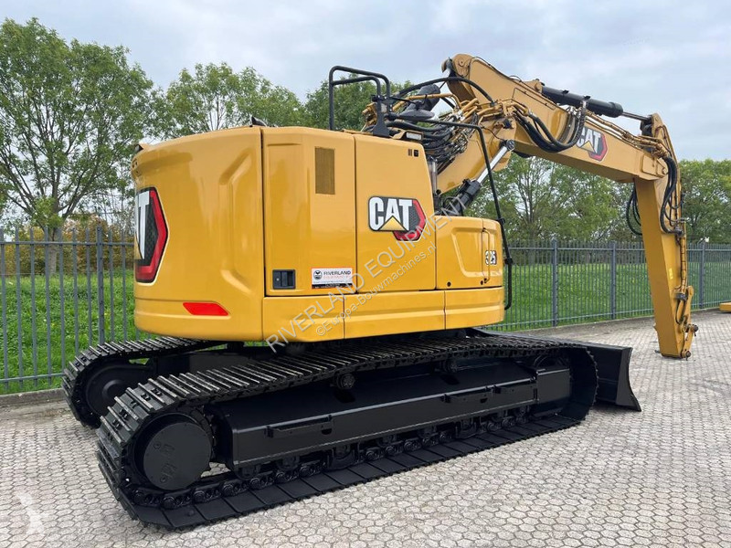 Rýpadlo Caterpillar 325 with dozerblade 1085...