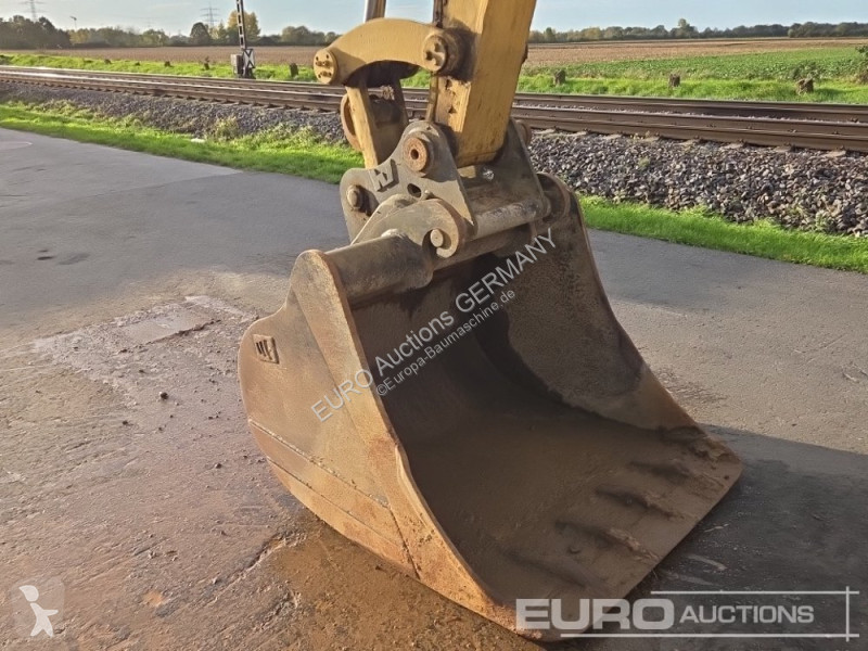 Багер Caterpillar 215C