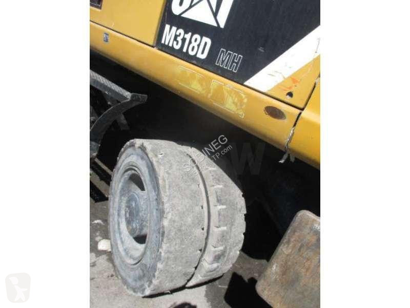 Багер Caterpillar MH
