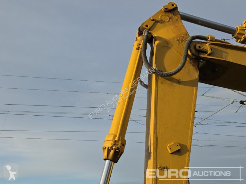 Багер Caterpillar 215C