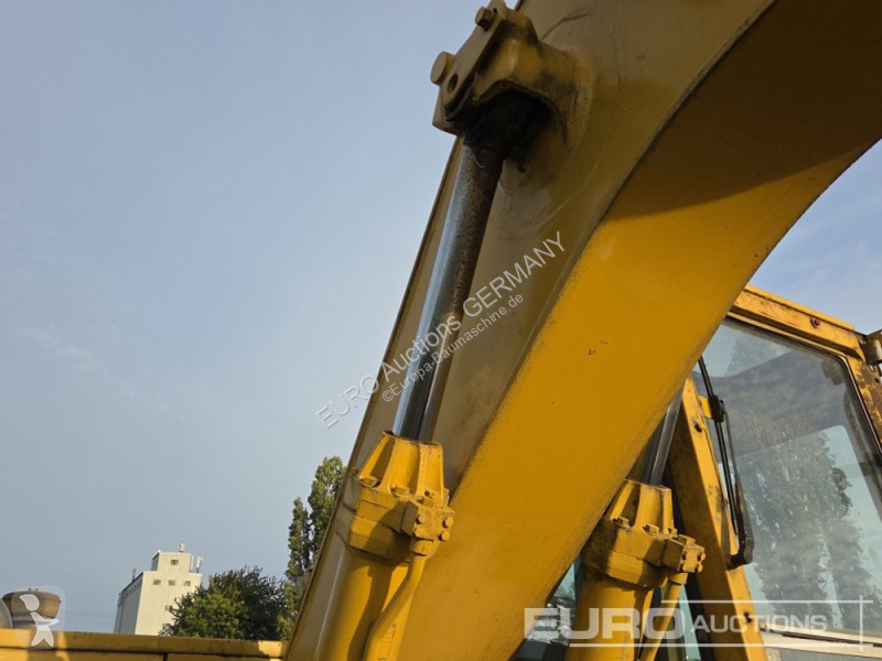Багер Caterpillar 215C