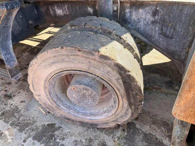 Багер Caterpillar MH