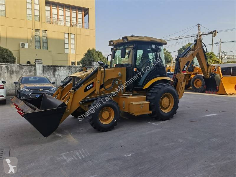 Traktor med grab Caterpillar 430F