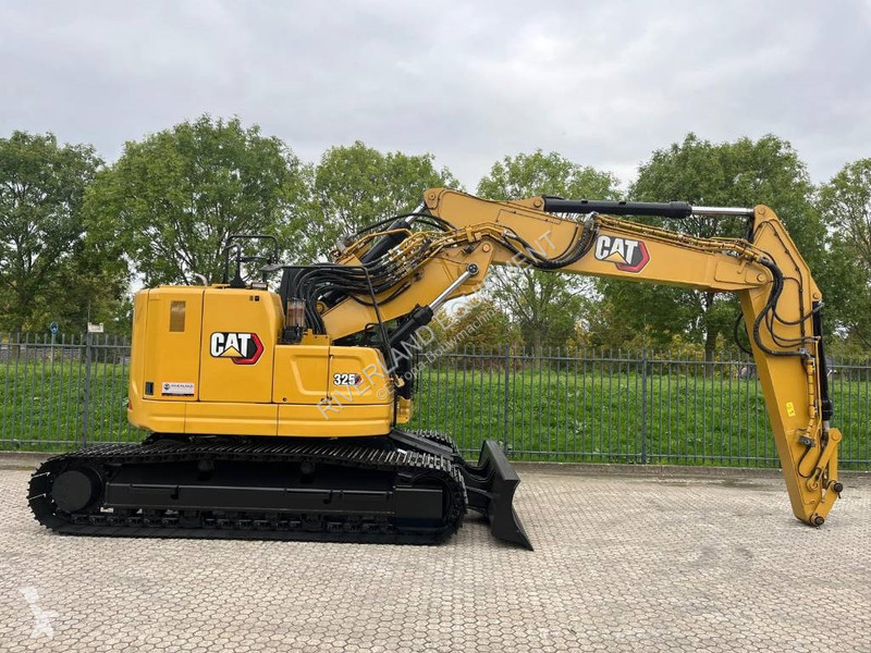 Rýpadlo Caterpillar 325 with dozerblade 1085...