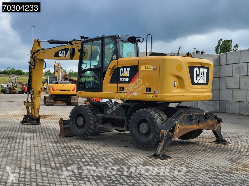 جرافة Caterpillar F F Outrigger + Blade