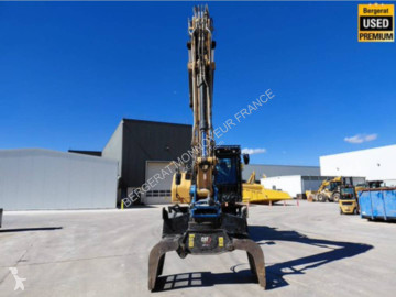 Graafmachine op banden Caterpillar