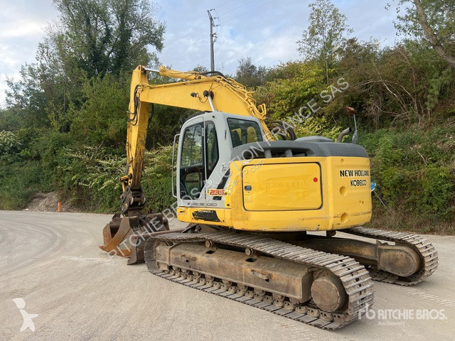 Pelle New Holland E235B
