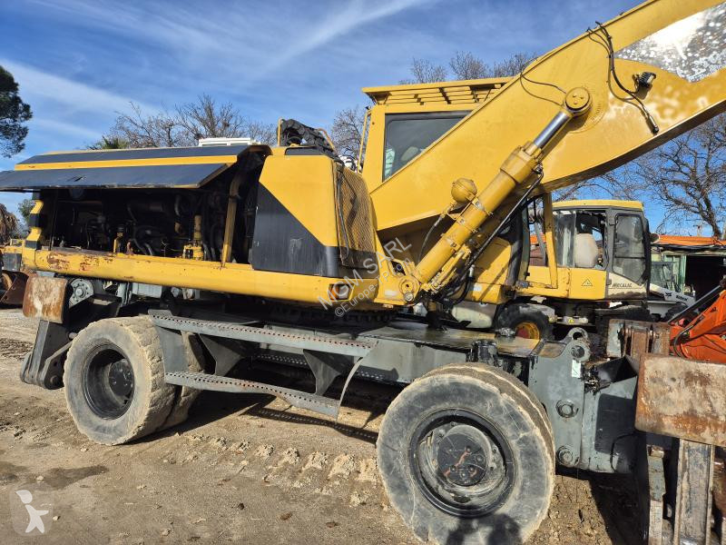 جرافة Caterpillar M Mono