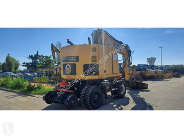 Колесен багер Caterpillar