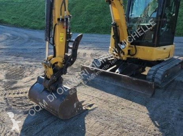 Минибагер Caterpillar