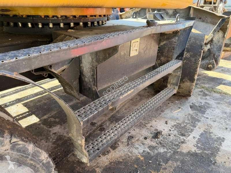Багер Caterpillar MH