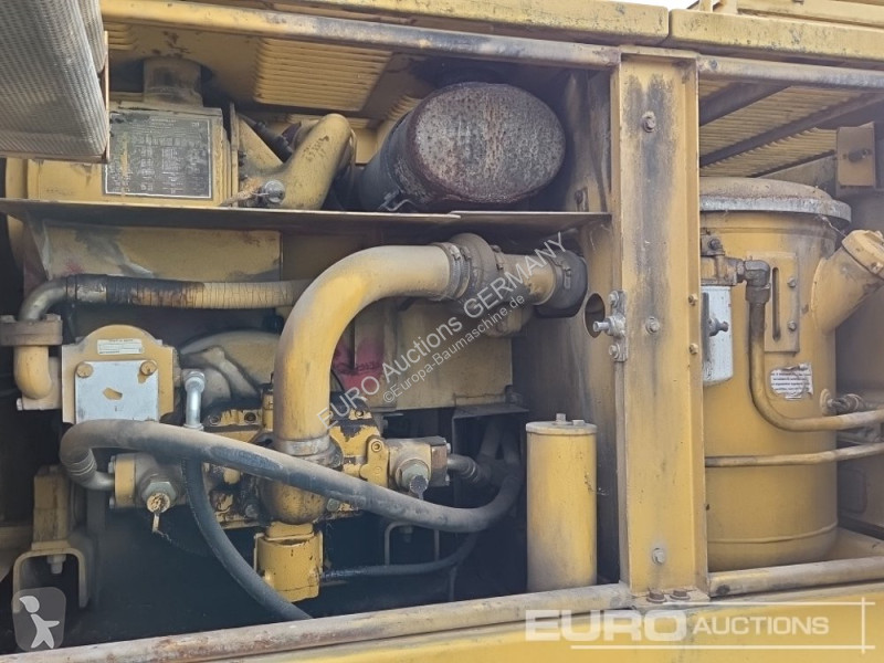 Багер Caterpillar 215C