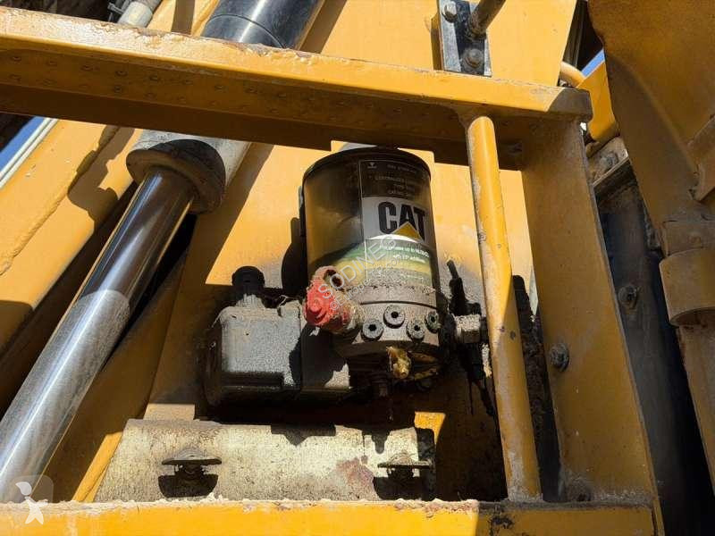 Багер Caterpillar MH