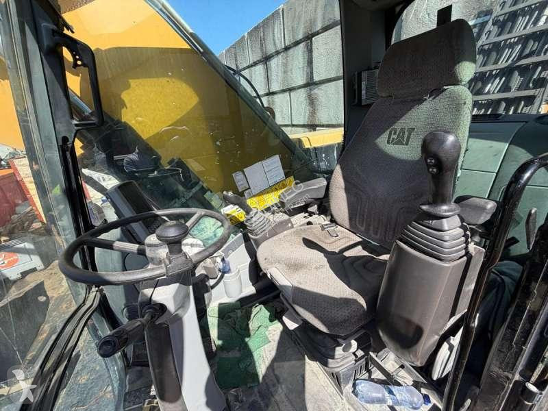 Багер Caterpillar MH