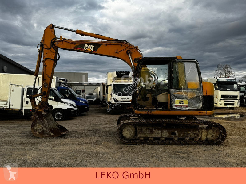 Rýpadlo Caterpillar 311C Mit Zwei Löffeln