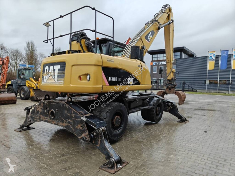 Escavatore Caterpillar M 318 D MH + GRAB
