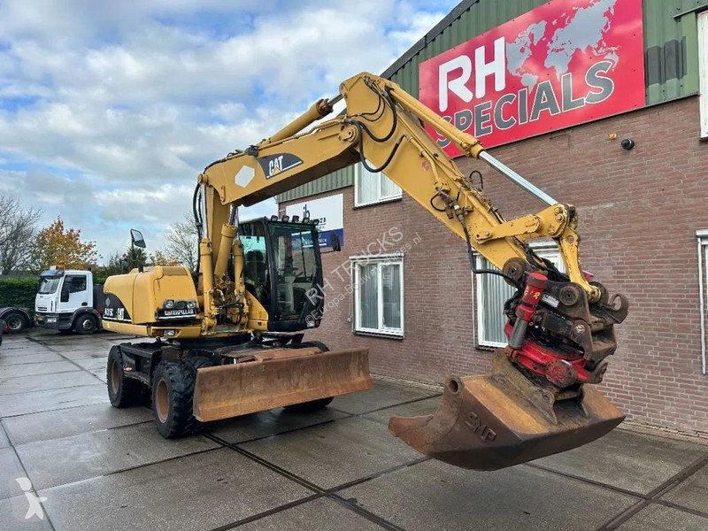 جرافة Caterpillar C WITH ROTOTILT