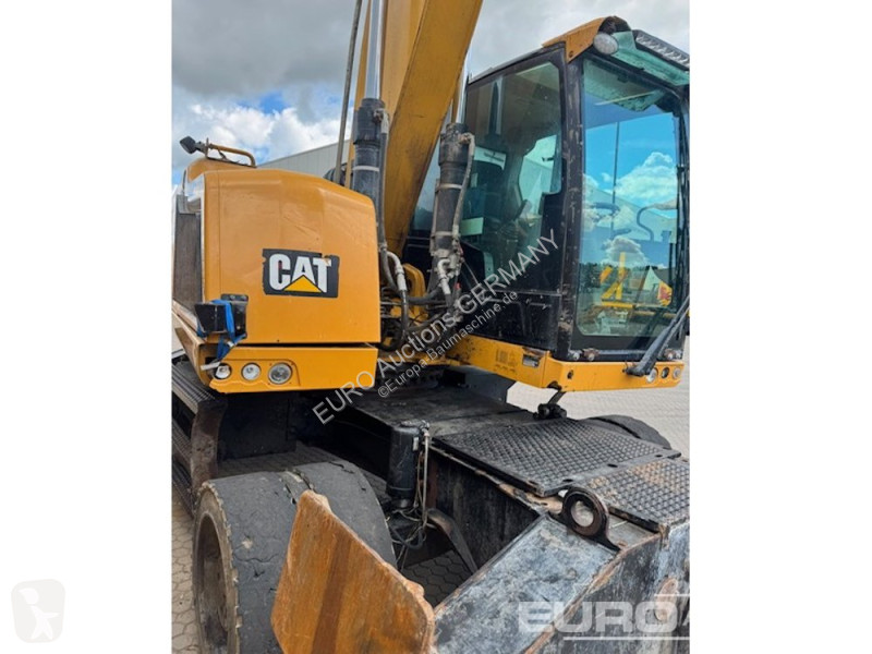 Багер Caterpillar MH3024