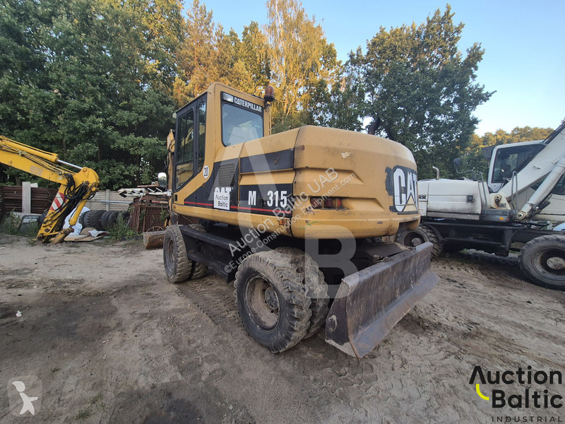 Екскаватор Caterpillar