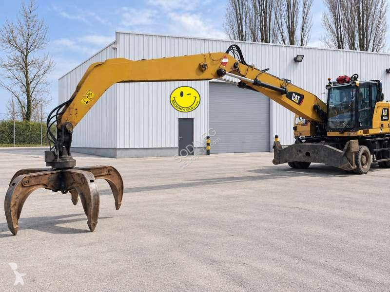 Skovel Caterpillar MH4 + grappin + GRAPPIN