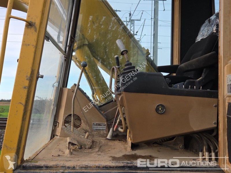 Багер Caterpillar 215C