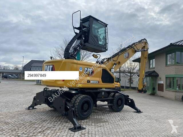 Skovel Caterpillar MH 3024 MIETE / RENTAL...