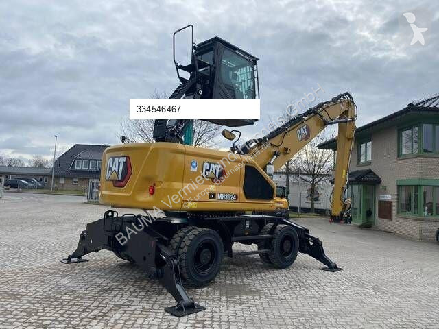 جرافة Caterpillar MH 3024 MIETE / RENTAL...