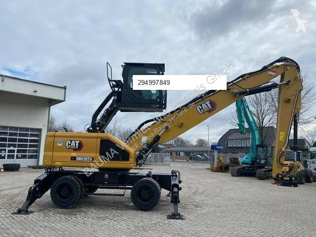 Skovel Caterpillar MH 3024 MIETE / RENTAL...