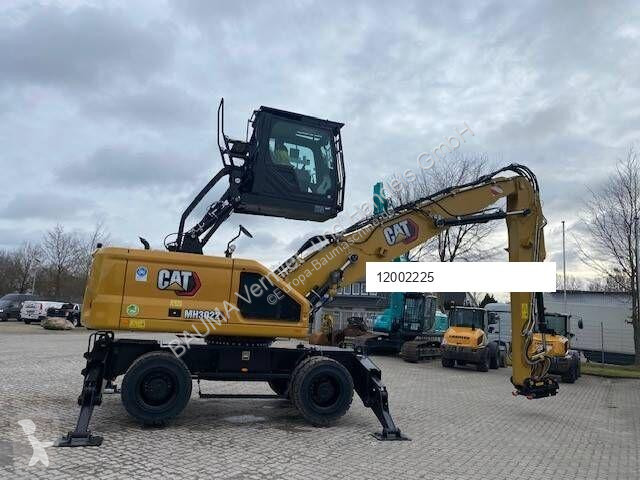 Graafmachine Caterpillar MH 3022 MIETE / RENTAL...