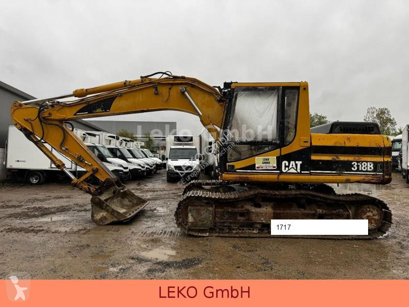 Escavatore Caterpillar 318B Mit Zwei Löffeln