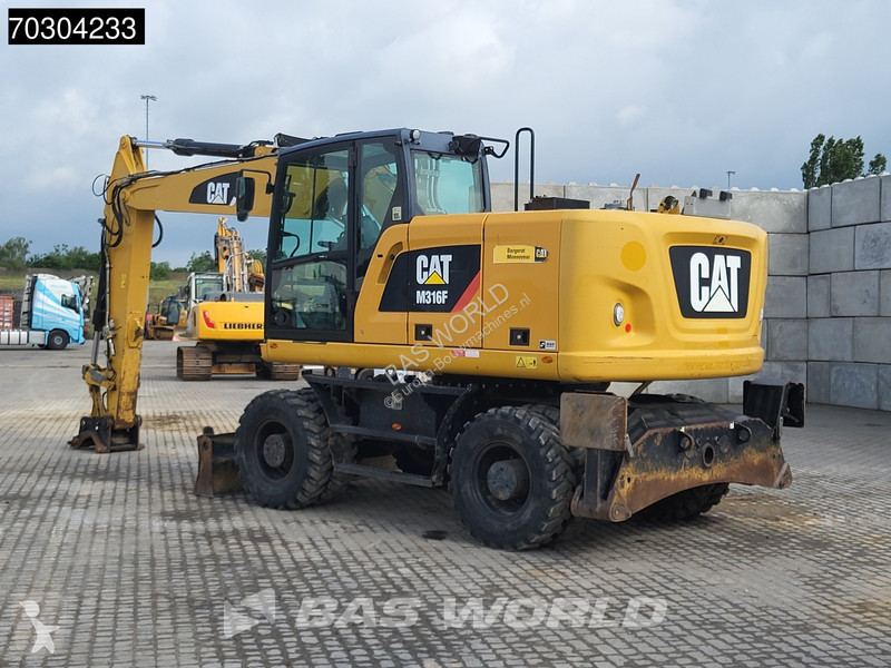 جرافة Caterpillar F F Outrigger + Blade