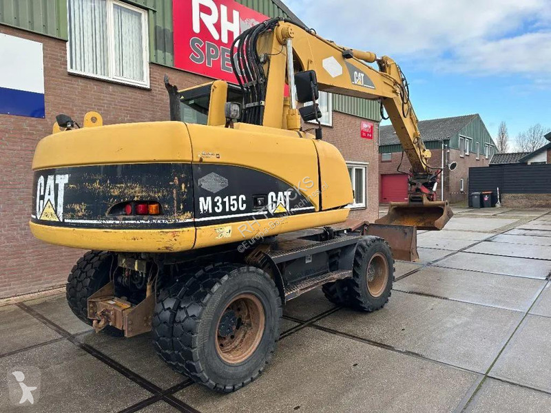 جرافة Caterpillar C WITH ROTOTILT