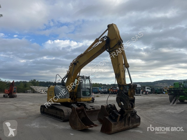 Pelle New Holland E235B