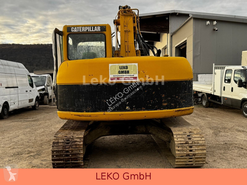 Rýpadlo Caterpillar 311C Mit Zwei Löffeln
