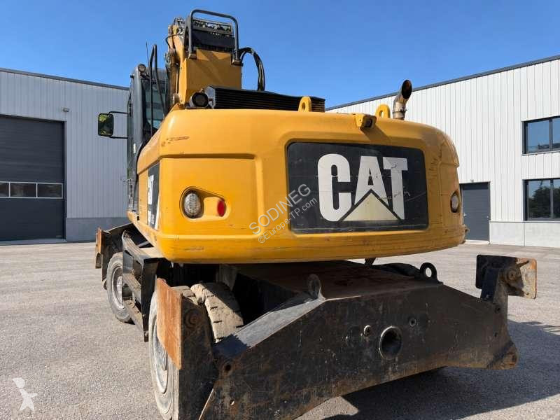 Багер Caterpillar MH