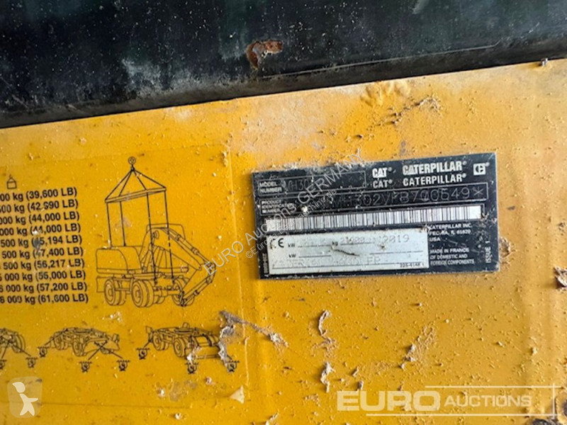 Багер Caterpillar MH3024
