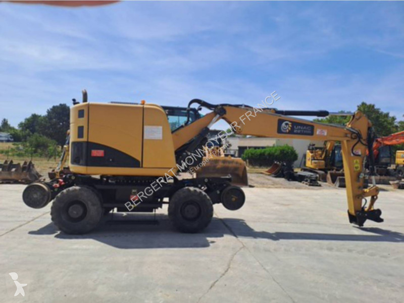 Багер Caterpillar M315D