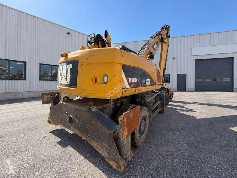 Багер Caterpillar MH