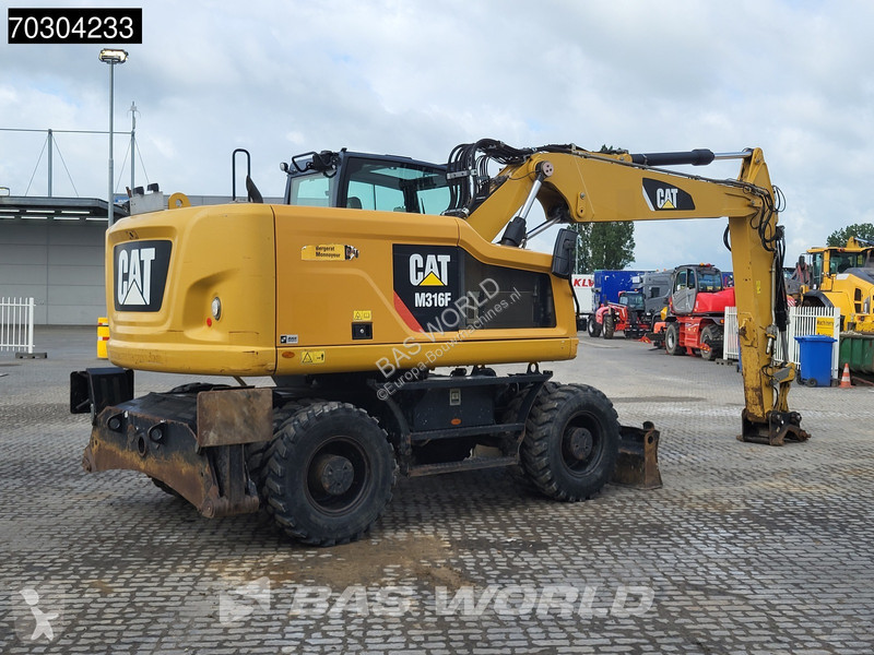 جرافة Caterpillar F F Outrigger + Blade
