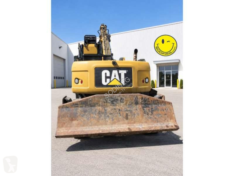 Багер Caterpillar MH