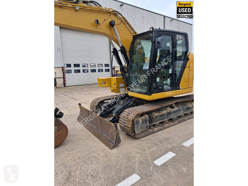 Багер Caterpillar GC