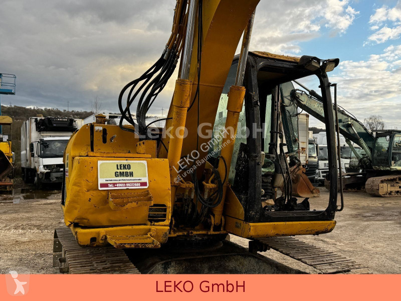 Rýpadlo Caterpillar 311C Mit Zwei Löffeln