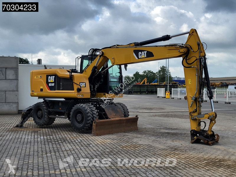 جرافة Caterpillar F F Outrigger + Blade