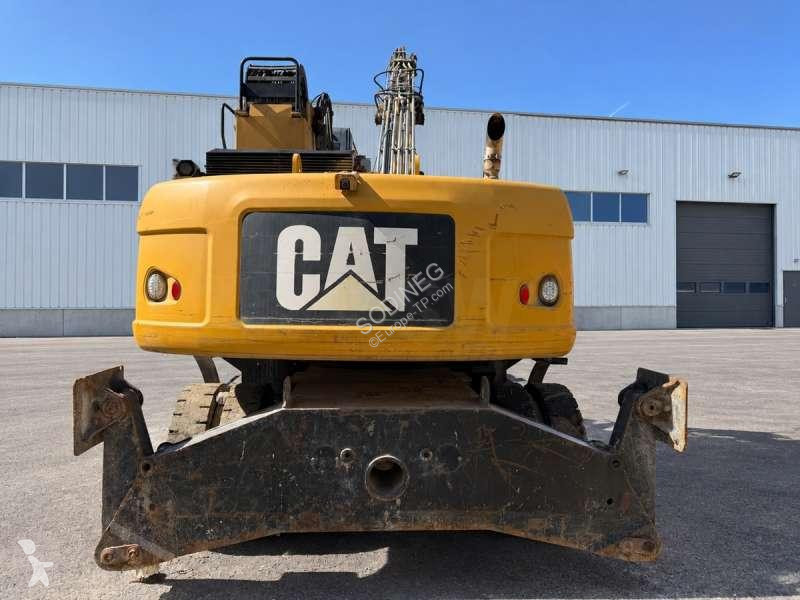 Багер Caterpillar MH