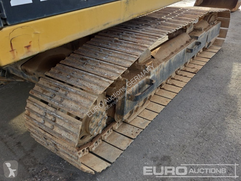 Багер Caterpillar 215C