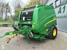 جمع الحشيش John Deere مكبس حزمات قشّ دائرية مستعمل