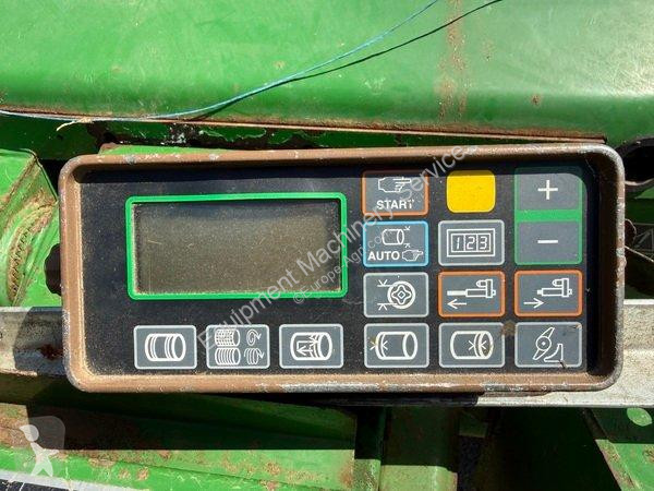John Deere  580 haymaking