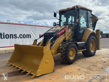 Traktor med grab Caterpillar 424