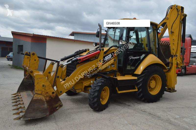 Traktor med grab Caterpillar
