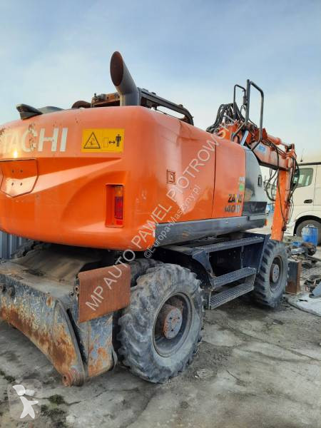 Traktor med grab Hitachi ZX210W-3